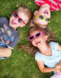 22306348-laughing-children-relaxing-during-summer-day